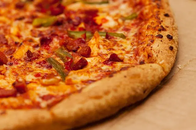 A freshly made pizza pie.