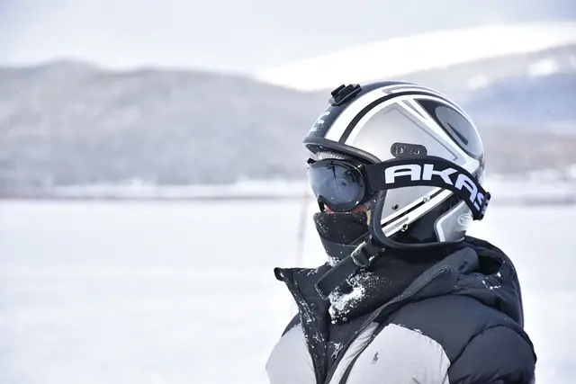 Skiier wearing helmet and goggles
